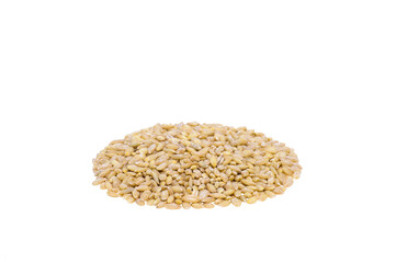 A handful of pearl barley grains on an isolated white background