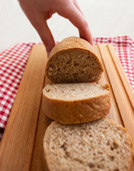 Sliced bread isolated on textured light grey background. Healthy bread. Ketogenic diet.