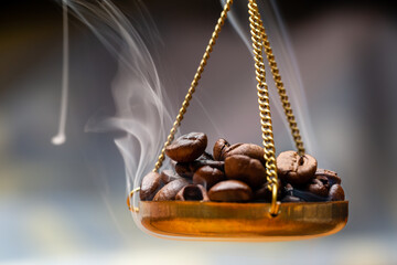 Roasted coffee beans on a scale/weighting machine