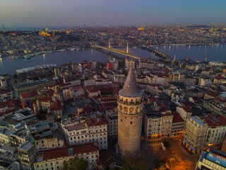 Aerial Galata Tower at Sunset. 
Galata Bridge and Golden Horn of Istanbul with beautiful colors at Sunset. 