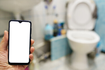 men plumber using digital smart phone in the toilet. mockup image