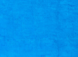 Bright blue concrete wall texture background.