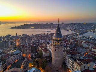 Naklejka premium Aerial Galata Tower at Sunset. Galata Bridge and Golden Horn of Istanbul with beautiful colors at Sunset. 