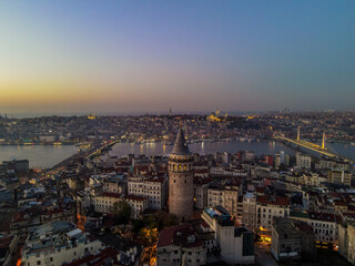 Obraz premium Aerial Galata Tower at Sunset. Galata Bridge and Golden Horn of Istanbul with beautiful colors at Sunset. 
