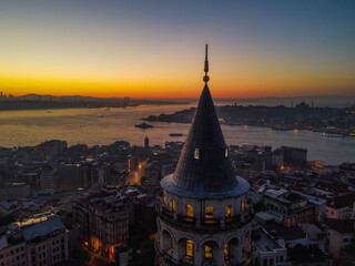 Aerial Galata Tower at Sunset. 
Galata Bridge and Golden Horn of Istanbul with beautiful colors at Sunset. 