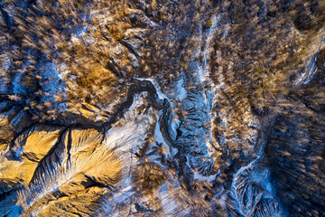 areal view sandy hills lakes rivers terrain old sand mines covered with first snow