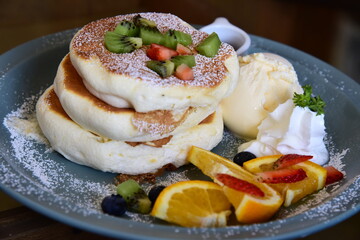 Mix fruit and pan cake sandwich with Icecream and whip cream.