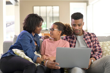 Fototapeta premium Happy family of three connected with laptop to communicate with relatives
