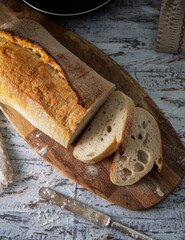 Fresh white bread on a wooden table