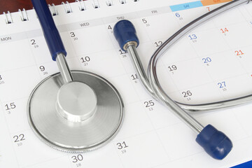 Regular medical examination concept, stethoscope on calendar	