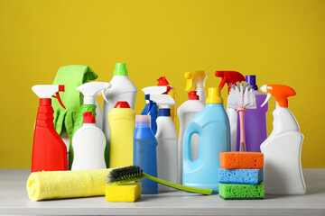 Different cleaning products and supplies on light table