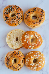 Flat lay of bagel breakfast on light table, top view