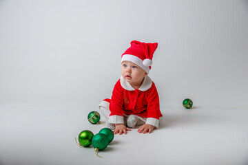 a baby in a Santa Claus costume on a white background