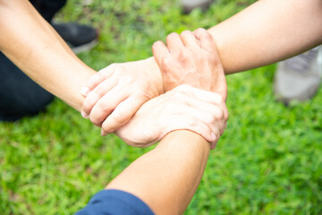 Solidarity unite people hands together community teamwork. Hands of spirit team working together outdoor. Unity strong handshake with people or agreement of feeling or happy diverse education action