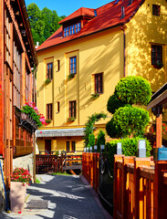 Fototapeta na wymiar Cesky Krumlov. Czech Republic. Antique house. Picturesque landscape old town in summer sunny day. Authentic buildings with red tile at roof.