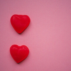 Gummy hearts with pink background. Valentine concept. Copy space