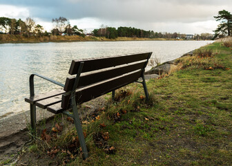 Bench on coast of canal.