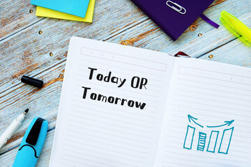 Financial concept about Today OR Tomorrow with inscription on the piece of paper.