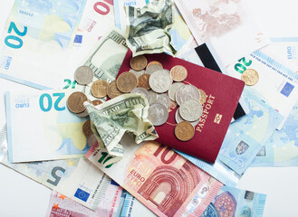 Cash on table isolated: dollars, euro, rubl broken money. All in mess, global crisis . passport travel concept