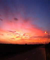 Naklejka na ściany i meble Beautiful view of the sunset with colourful sky