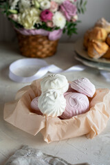 Fototapeta na wymiar Homemade colored marshmallow in a basket