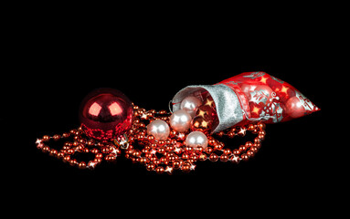 Christmas balls and beads on a black background © Germanova Antonina