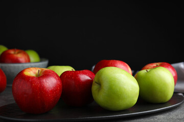 Fresh ripe green apples on slate plate, closeup