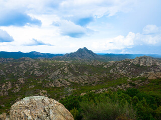 Fototapeta na wymiar Panoramic view of the peaks of the Corsica Mountains along the GR20 hiking route. Corsica inland