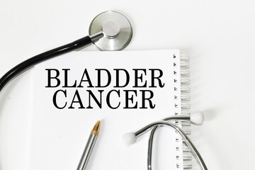 medical text BLADDER CANCER on the card. white background, stethoscope, medicine. medical concept