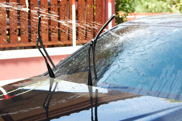 Washing car windshield with water