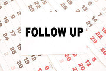 text FOLLOW UP on a sheet from Notepad.a digital background. business concept . business and Finance.