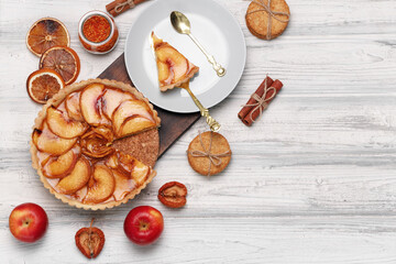 Top view of an apple pie on white wooden surface