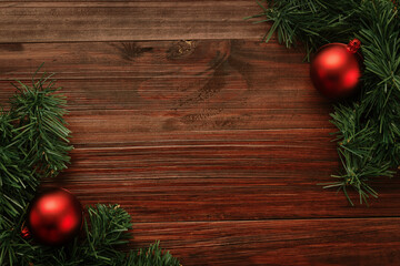 Fototapeta na wymiar Christmas and new year with red balls decoration on wooden table background top view with copy space.