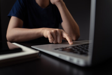 Hands typing message on keyboard laptop.