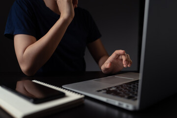 Hands typing message on keyboard laptop.