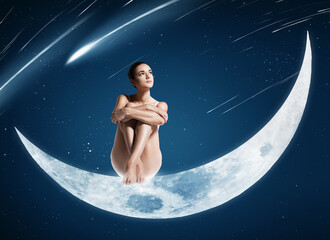 healthy woman sitting on shiny moon
