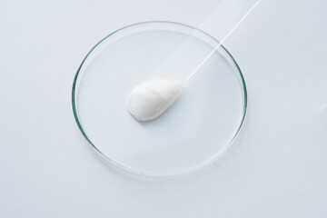 Medical issues, white cream on glass