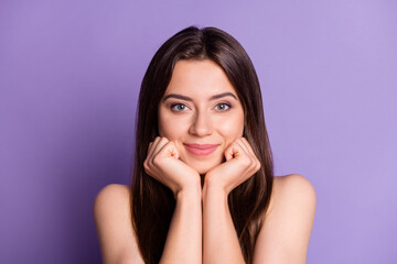 Fototapeta premium Photo portrait of cute girl holding face chin with two hands fists isolated on vivid violet colored background