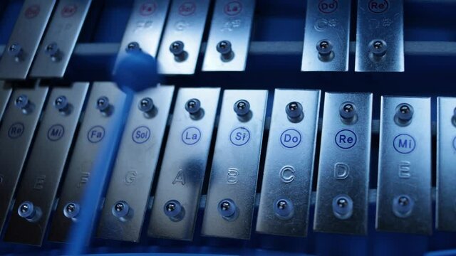 Playing the xylophone in a nice blue light