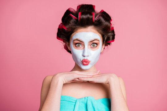 Close-up portrait of pretty funky childish housewife wearing natural organic mask lifting pout lips isolated over pink color background