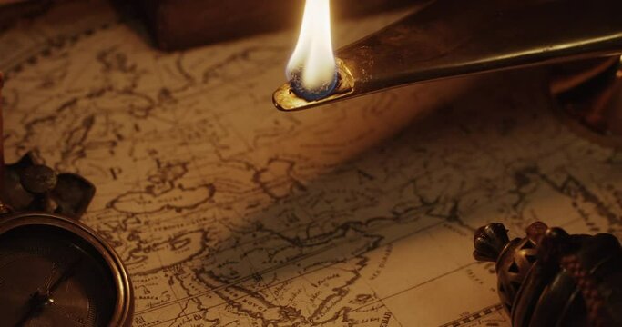 Ancient map of the XVII century illuminated by oil lamp