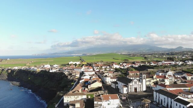 4k drone footage of a beautiful community overlooking the coast of Azores, Portugal.