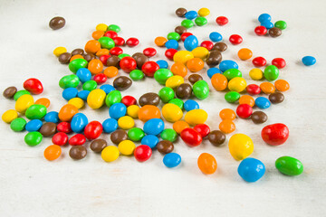 Chocolate candy on the white background, colorful candy texture.