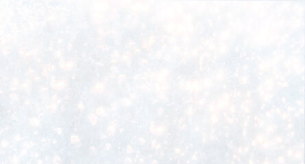 Christmas ornaments on snow with copy space. Glossy red balls top view. .