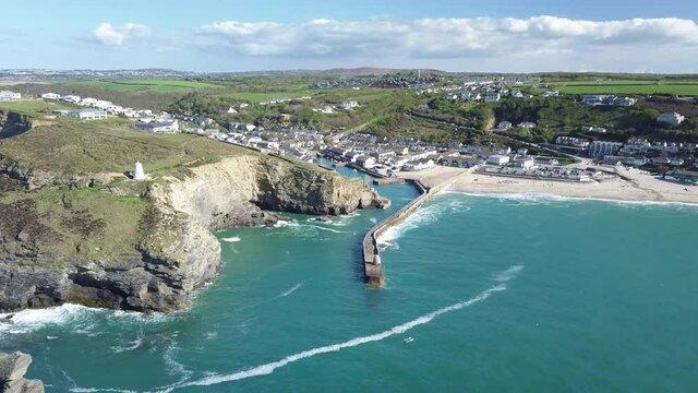 Picturesque Landscape Of Portreath Village With Monkey Hut On Pier And The Pepper Pot Lighthouse On Summer In Redruth, Cornwall, England. - aerial