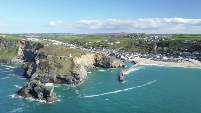 Panoramic View Of Portreath Village, Beach, And Waves On Turquoise Blue Sea During Summer In Redruth, Cornwall, England. - aerial