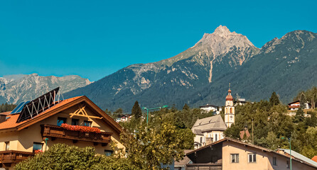 Beautiful alpine summer view with a church and mountains in the background at Tarrenz, Tyrol, Austria