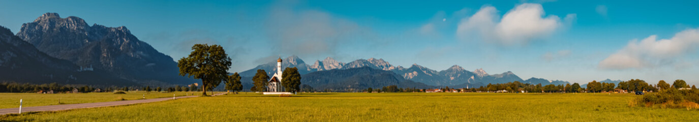 High resolution stitched panorama of a beautiful alpine view at the famous church Saint Coloman near castle Neuschwanstein, Schwangau, Bavaria, Germany