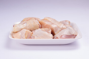 Raw chicken tender curry cut with skin