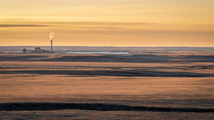 sunrise over prairie and foothills of northern Colorado near Fort Collins with a distant power plant